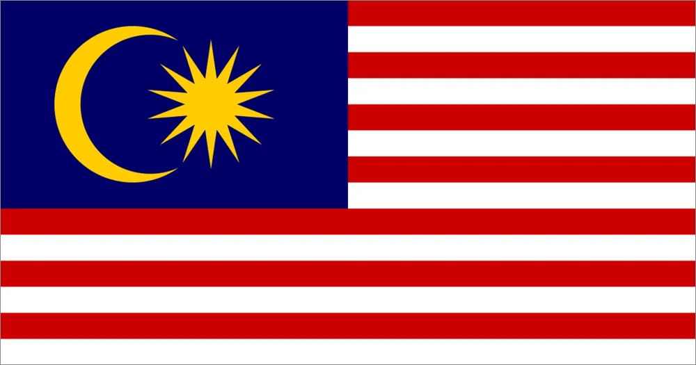 Flag of Malaysia featuring red and white stripes with a blue canton containing a yellow crescent and a 14-pointed star.