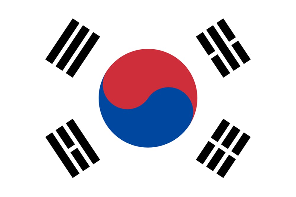 South Korea national flag featuring a central yin-yang symbol in red and blue, with four black trigrams surrounding it.