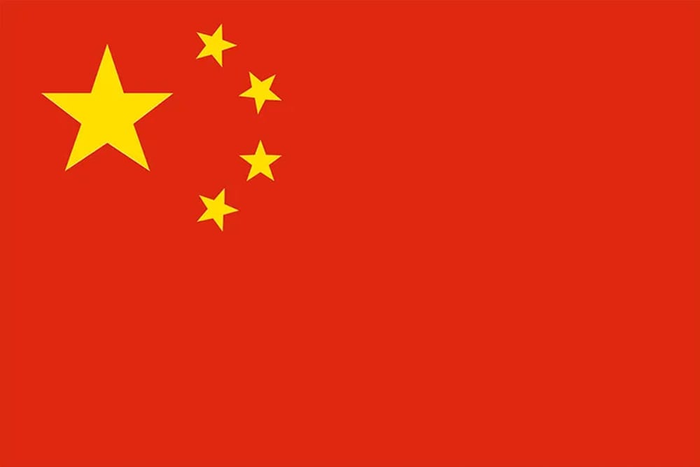 Chinese flag featuring a large yellow star and four smaller yellow stars on a red background.