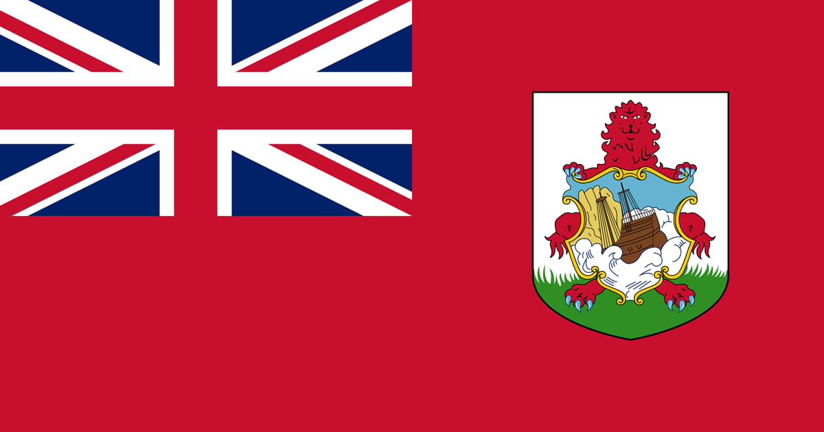 Bermuda flag featuring a red field with a blue ensign and the coat of arms depicting a lion, ship, and greenery.