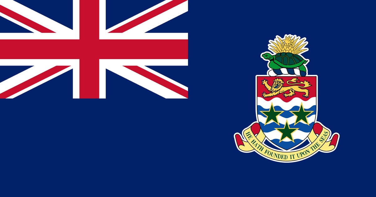 Flag of the Cayman Islands featuring the Union Jack and the coat of arms with a turtle, lion, and stars on a blue background.