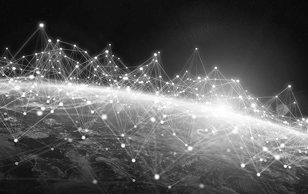 A network of connected points and lines over a globe, representing global connectivity and data flow in a digital world.