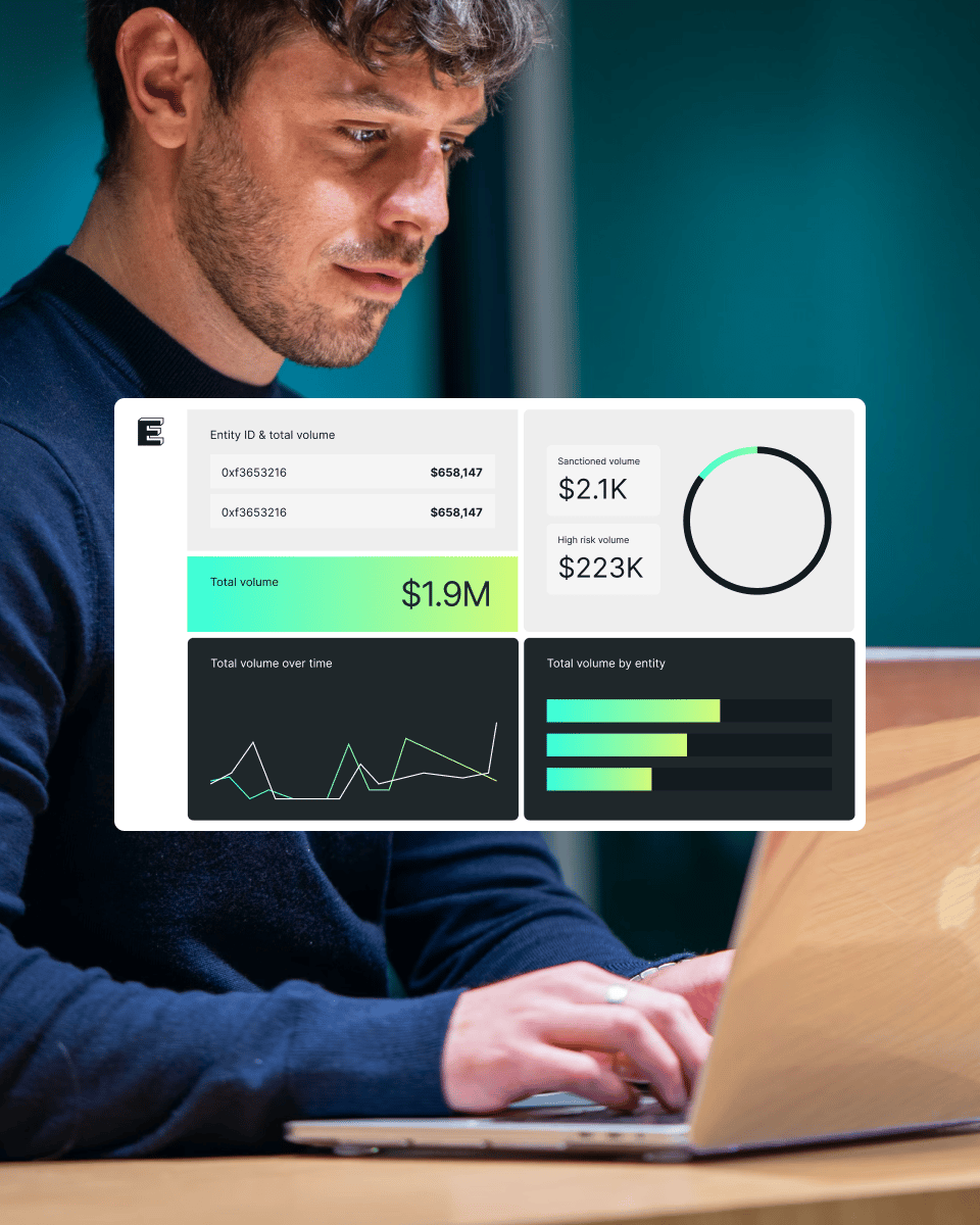 Person working on a laptop, focusing on displayed financial graphics and data, including total volume and entity information.